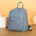 Blue leather women backpack detail, stylish casual daypack with multiple zippered pockets. - Blue