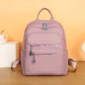 Pink faux leather women backpack detail, multiple zipper pockets, casual daily design. - Pink