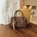 Brown suede handbag detail, retro style shoulder bag with beaded charm and top handle. - With Pendant / Brown