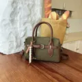 Vintage green suede handbag with brown handles, retro shoulder crossbody bag for women. - With Pendant / Green