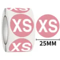 Pink round clothing size sticker roll featuring white XS label and 25mm diameter indicator. - XS / 500 Sheets/Roll / Pink