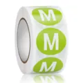 Detailed view of green round clothing size M adhesive sticker roll for garment sorting and marking. - M / Green