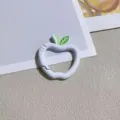 Close-up detail shot of cute apple-shaped spring ring keychain with green leaf accent. - Apple with Spring Clasp / White