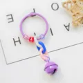 Detailed view of DIY creative keychain with purple bell, colorful plastic beads and chains. - Purple