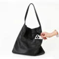 Black faux leather hobo shoulder bag, large capacity casual daily tote with front pocket. - Black