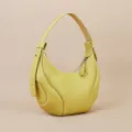 Yellow leather crescent shoulder bag for women, stylish underarm hobo bag with contrast stitching. - Yellow