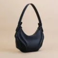 Black leather crescent shoulder bag, stylish underarm purse with contrast stitching for women. - Black