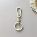 Zinc alloy spring keychain ring carabiner car waist hanging clip bag accessory detail view. - Beige Clasp