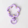Purple flower shaped diy keychain clasp detail, enamel metal snap hook accessory close up. - Purple