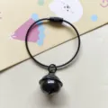 Black metal bell pendant with wire loop key ring, detailed close-up shot of the hanging ornament. - Black Wire Keychain Ring & 22mm Bell