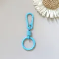Detailed shot of the vibrant blue metal spring keychain clasp, highlighting the sturdy alloy mechanism. - Blue Hanging Clasp