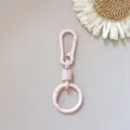 Pink zinc alloy spring keychain ring clasp hook, durable metal bag hardware accessory detail view. - Light Pink Hanging Clasps