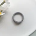 Close up detail of grey metal spring ring buckle accessory, 25mm round key chain pendant. - Gray