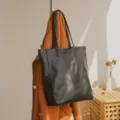 Minimalist black leather tote bag for women, large capacity shoulder bag for daily commuting. - Black