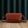 Women brown leather crossbody bag, stylish retro shoulder bag with metal hardware. - Coffee