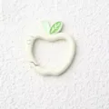 Close-up detail view of the cute apple-shaped spring ring clasp with green leaf accent. - Apple with Spring Clasp / Beige