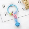 Detailed view of creative bell keychain with colorful letter beads and plastic chains. - Blue