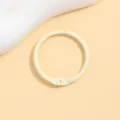 Detail view of a beige painted metal loose leaf binder ring, perfect for DIY crafts and accessories. - 30mm / Beige