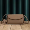 Brown soft leather crossbody bag featuring cute elephant charm and casual cloud shoulder bag. - Tea Brown