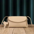 Beige leather crossbody bag for women, soft cowhide shoulder bag with cute elephant charm. - Milky Apricot