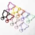 Detailed view of colorful bear-shaped metal spring rings, swivel clasps for DIY jewelry and keychains. - Bear with Spring Clasp / Multicolor