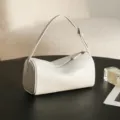 White cylindrical shoulder bag, soft leather barrel bag, minimalist casual crossbody bag. - White