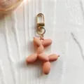 Mooi roze ballon hond sleutelhanger detail, schattige hanger voor handtas decoratie - Oranje