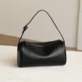 Minimalist black soft leather cylindrical shoulder bag, stylish casual barrel pillow bag. - Black