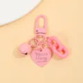 Porte-clés sac rose macaron avec pendentif cœur et chaîne épaisse pour accessoires. - Rose
