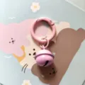 Cute pink metal spring ring keychain with a small bell charm for stylish bags and keys. - Pink Spring Clasp with 18mm Bell and Open Jump Ring
