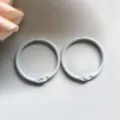 Close-up detail of light gray metal binder rings, smooth painted surface for DIY crafts. - 30mm / Light Blue