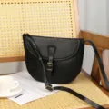 Black genuine leather saddle bag vintage crossbody bag with adjustable strap and buckle. - Black