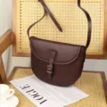 Vintage brown leather saddle bag for women, casual crossbody shoulder bag with adjustable strap. - Coffee
