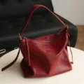 Red leather shoulder bag for women, stylish vintage hobo tote and versatile underarm bag. - Red