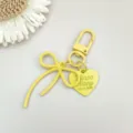 Gele legering strik sleutelhanger met hart hanger schattige tas charm accessoire metaal - Gele ringkarabijnsluiting + legering strik + legering hartstuk