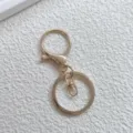 Gouden metalen karabijnhaak sleutelhanger accessoire detail voor DIY tassenhangers. - 3-delige set karabijnsluitingen in KC goud