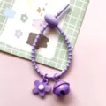Purple silicone tie accessory with cute flower charm and bell detail for DIY bags and items. - Cable Tie Bell Flower / Purple