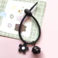 Black silicone cable tie accessory with flower pendant and bell for DIY bag keychains. - Cable Tie Bell Flower / Black