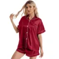 Detailed view of women's short-sleeve satin pajama set with contrast white piping and buttons. - L / Top And Bottom / Red