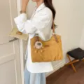 Retro yellow brown shoulder tote bag large capacity casual commuter bag with plush charm. - Brown with Pendant