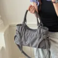 Trendy grey suede shoulder bag for women with chic metal rivets and versatile crossbody strap. - Gray