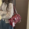 Dark red patent leather shoulder bag for women, large capacity commuter pillow bag style. - Red