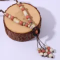 Boho ethnic ceramic beaded long tassel sweater chain detail view for vintage apparel matching. - Style W874