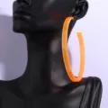 Oversized neon orange acrylic hoop earrings, bold statement jewelry for modern street style. - Orange