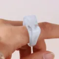 Close-up detail view of a trendy white and blue marbled acrylic geometric statement ring. - Size 7 / Light Blue