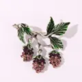 Vintage berry branch brooch with green enamel leaves and sparkling crystal rhinestones for women. - Purple