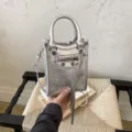 Silver metallic mini vertical handbag, stylish PU leather shoulder crossbody phone bag. - Silver