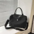 Bolso de viaje negro, gran bolsa de hombro cruzada de lona con correa ancha y comoda. - Negro