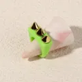 Detailed close-up view of a neon green acrylic punk ring featuring three gold-tone metal spikes. - One Size / Green