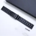 Detailed view of black titanium metal watch band featuring folding clasp and spring bars. - 18mm / Black
